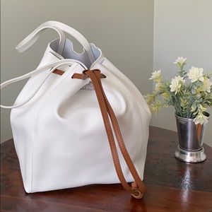 White leather draw string bag.